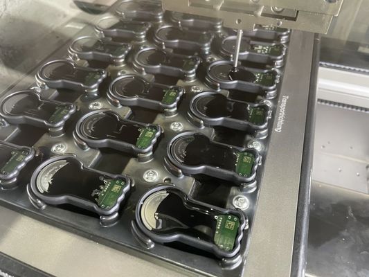 Macchina di confezionamento a condensatore con distributore di epossidi in resina PU a 2 componenti